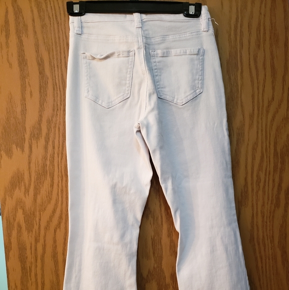 Cute white jeans, ripped at knees with flare bottoms. Great condition. - Picture 6 of 8